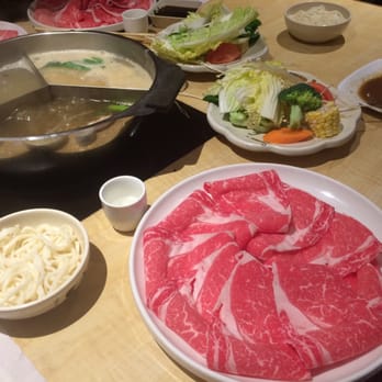 Shabu-Zen - A1 with udon noodles, the plate of complimentary vegetables, and three different broths to work with. - Japanese Near Me - Boston, Massachusetts Shabu-Zen - A1 with udon noodles, the plate of complimentary vegetables, and three different broths to work with. - Japanese Near Me - Boston, Massachusetts