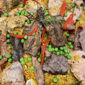 Cafe Sevilla - Meat paella was very flavorful. We ordered a family size $55 to share with 4 of us, but couldn't finish it. - Spanish Near Me - Costa Mesa, California