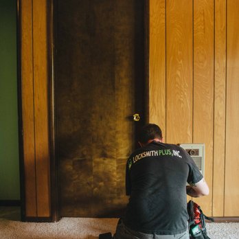 Locksmith Plus - A technician getting ready to open up an apartment. - Keys & Locksmiths Near Me Locksmith Plus - A technician getting ready to open up an apartment. - Keys & Locksmiths Near Me