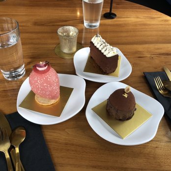 Edwards Dessert Kitchen - Chocolate crème pie, (pink) strawberry lime leaf, (domed) Rocher Mousse, my favorite - Desserts Near Me - Minneapolis, Minnesota