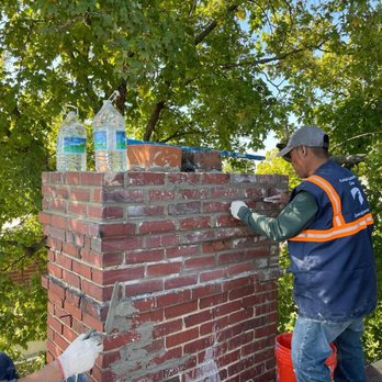 Komodo Construction Group - two men working on a brick chimney - General Contractors Near Me - Washington, DC, District of Columbia Komodo Construction Group - two men working on a brick chimney - General Contractors Near Me - Washington, DC, District of Columbia