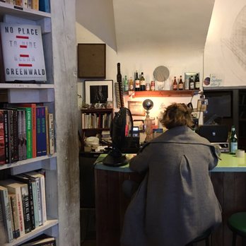 Molasses Books - a woman sitting at a bar - Bookstores Near Me - Brooklyn, New York