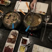 Photo of The Melting Pot - Orlando, FL, United States. Coq au Vin and Mojo cooking styles