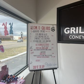 Grill House - a menu and a sign in front of a window - American Near Me - Fraser, Michigan