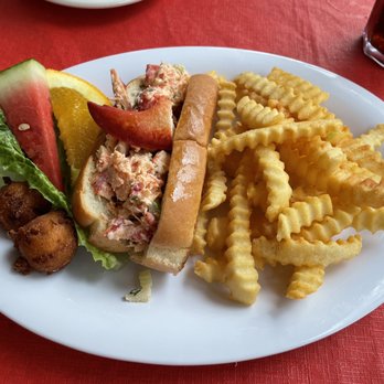Tonys Chowder House - Lobster Roll (Mayo and celery) with fries and hush puppies. - Seafood Near Me - Mount Dora, Florida Tonys Chowder House - Lobster Roll (Mayo and celery) with fries and hush puppies. - Seafood Near Me - Mount Dora, Florida