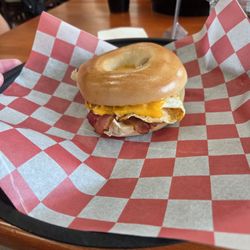 Breakfast sandwich on a bagel with bacon