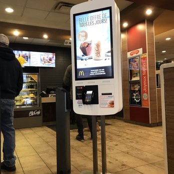 McDonald's - a man standing in front of a digital menu kiosk - Fast Food Near Me - Saint-Jérôme, Quebec McDonald's - a man standing in front of a digital menu kiosk - Fast Food Near Me - Saint-Jérôme, Quebec