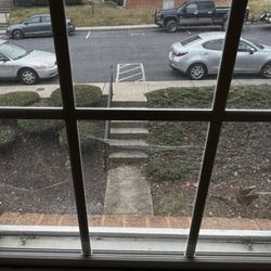 Matchbox Realty & Management Services - Spider webs window in common area