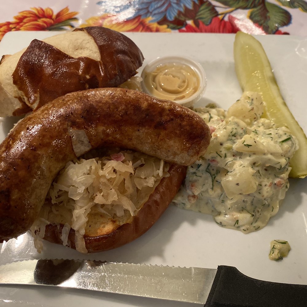 Das Cafe - Brat on pretzel bun with potato salad - Cafes Near Me - Spring City, Utah Das Cafe - Brat on pretzel bun with potato salad - Cafes Near Me - Spring City, Utah