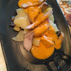 La Cueva de 1900 - Pluma ibérica con salsa de pimientos
