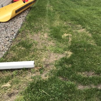 Clark - a yard with a lawn mower - General Contractors Near Me Clark - a yard with a lawn mower - General Contractors Near Me
