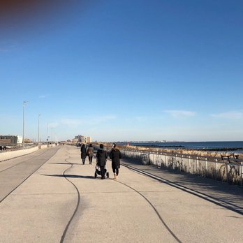 Super Burrito - a group of people walking down a sidewalk - Tex-Mex Near Me - Arverne, New York Super Burrito - a group of people walking down a sidewalk - Tex-Mex Near Me - Arverne, New York