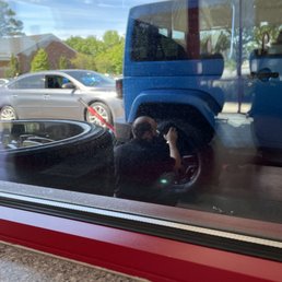 putting tire back on and shining.