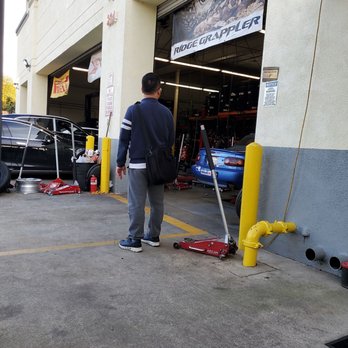 Tire Central - My Laguna metallic miata up on the hydraulic. - Tires Near Me - San Gabriel, California Tire Central - My Laguna metallic miata up on the hydraulic. - Tires Near Me - San Gabriel, California