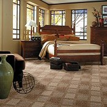 Floor Source - a bedroom with a bed, dressers, and a chair - Carpeting Near Me - Brodheadsville, Pennsylvania Floor Source - a bedroom with a bed, dressers, and a chair - Carpeting Near Me - Brodheadsville, Pennsylvania