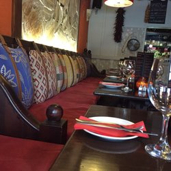 Tinto Tapas Bar - Cute seating bench with belted pillows as cushions.