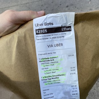 Lime Griffintown - a person holding a brown paper bag - Pan Asian Near Me - Montreal, Quebec