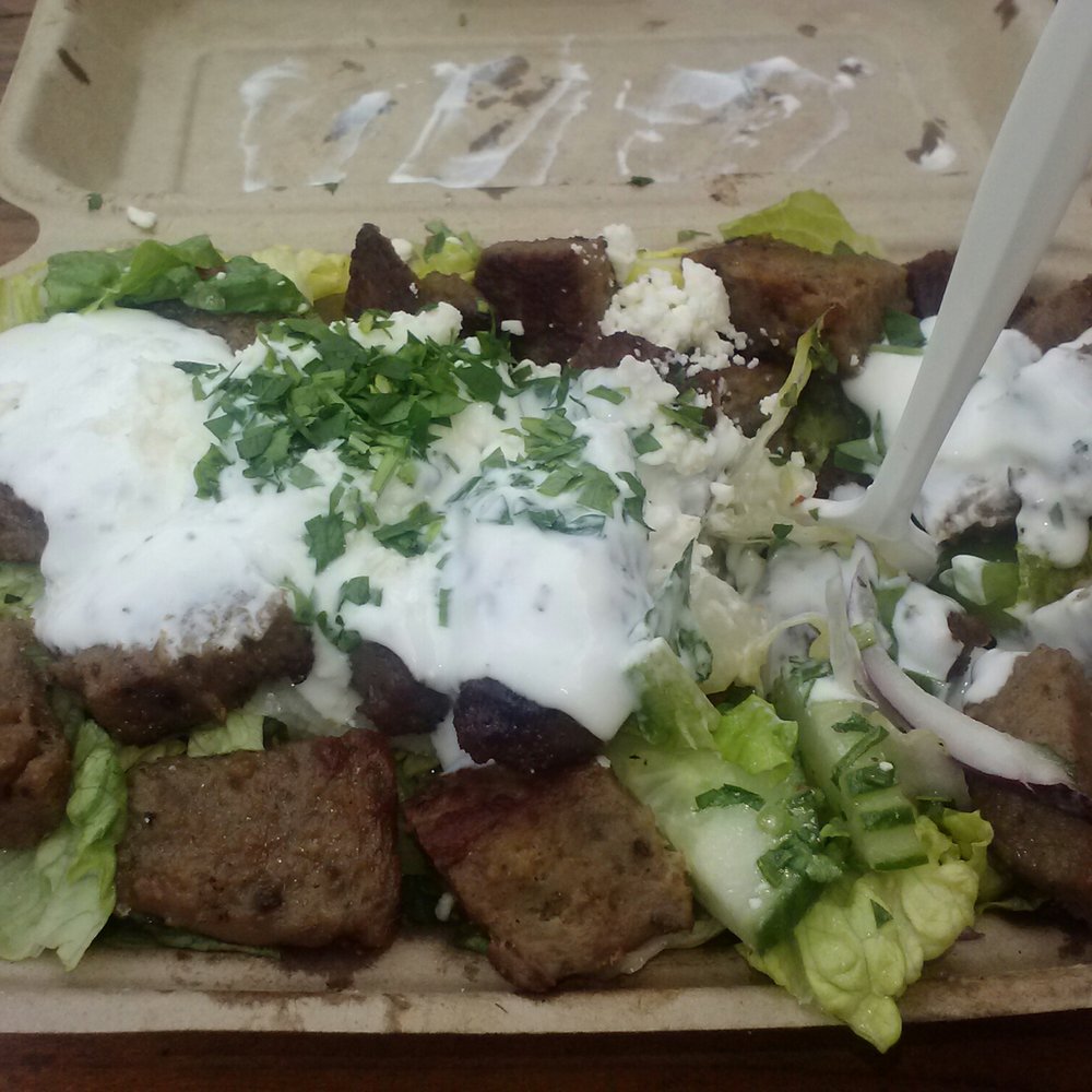 Mmmmmmmm. Lamb over fresh Greek salad with taziki sauce Mmmmmmmm. Lamb over fresh Greek salad with taziki sauce
