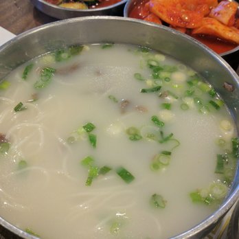 Kunjip - Sulrungtang for $12. Sides were kimchi, radish kimchi and spicy cucumber. Green onions and salt on the table. Comes with rice. - Korean Near Me - Santa Clara, California