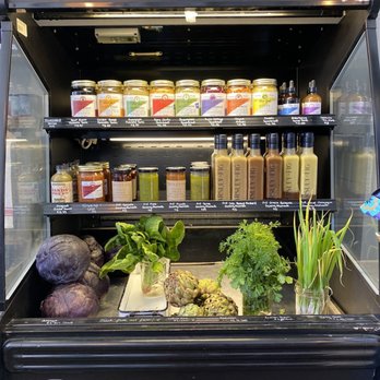 Radici Market - a display of vegetables and juices - Health Markets Near Me - Carmel, California Radici Market - a display of vegetables and juices - Health Markets Near Me - Carmel, California
