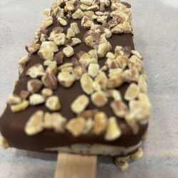 Chocolate dipped bar covered in almonds.