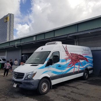 Seafood Connection - a delivery van parked in front of a building - Seafood Near Me - Honolulu, Hawaii