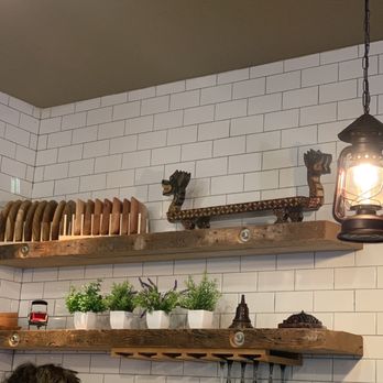 Satay Bistro - a kitchen with white tiles and wooden shelves - Indonesian Near Me - Philadelphia, Pennsylvania Satay Bistro - a kitchen with white tiles and wooden shelves - Indonesian Near Me - Philadelphia, Pennsylvania