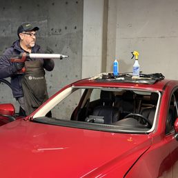 Juan at work. Notice that supplies are placed on top of a protective cloth, rather than just on top of my car. Nice touch of extra care. Juan at work. Notice that supplies are placed on top of a protective cloth, rather than just on top of my car. Nice touch of extra care.