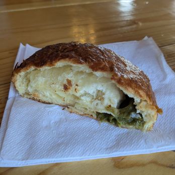 Flying Roadrunner Bakery - Cut in half: Green chili and Gouda croissant - Coffee & Tea Near Me - Albuquerque, New Mexico