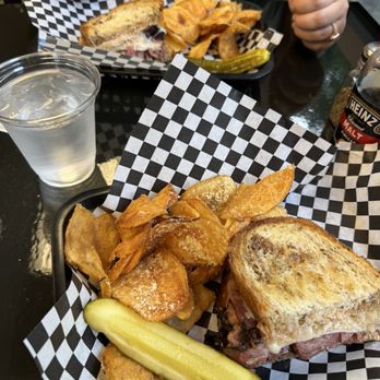 Pastrami Tom’s Deli & Grill - Pastrami Sandwich and Rosemary Parmesan Chips - Breakfast & Brunch Near Me - Cary, North Carolina Pastrami Tom’s Deli & Grill - Pastrami Sandwich and Rosemary Parmesan Chips - Breakfast & Brunch Near Me - Cary, North Carolina