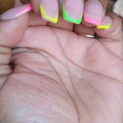 A Touch of Beauty Salon - The worst service ever. Not even a week yet and my nails look like Garbage. I paid over 50 dollars for trash. She gain my money from me. Smh