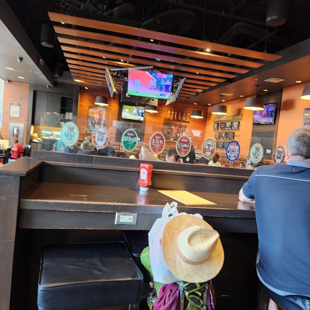 Mill Street Brewery - a man sitting at the bar - British Near Me - Mississauga, Ontario Mill Street Brewery - a man sitting at the bar - British Near Me - Mississauga, Ontario