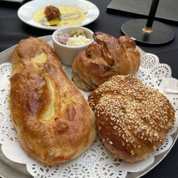 Doris Metropolitan - Bread plate and butters with oil and vinegar on the side - New American Near Me - New Orleans, Louisiana