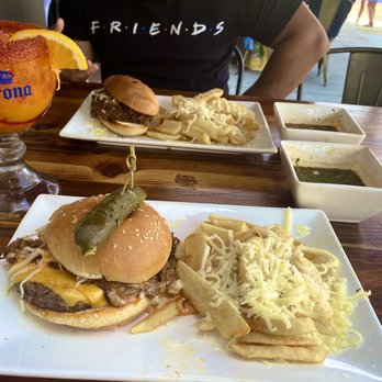 Tostadas - Top: Mexican Dip w/ truffle fries  Bottom: Birria Bacon Burger w truffle fries  Drink: Mangonedita - Breakfast & Brunch Near Me - San Jose, California