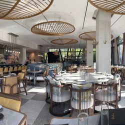 Akira Back - Dining area view with bar backdrop