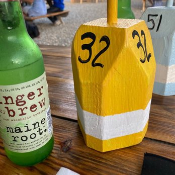 Shuck Station - Nice outdoor seating -Ginger beer and the colorful buoys with your order number - Seafood Near Me - Newcastle, Maine Shuck Station - Nice outdoor seating -Ginger beer and the colorful buoys with your order number - Seafood Near Me - Newcastle, Maine