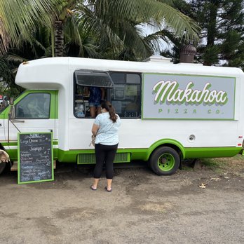 Makahoa Pizza - a woman standing in front of a food truck - Pizza Near Me - Kahuku, Hawaii Makahoa Pizza - a woman standing in front of a food truck - Pizza Near Me - Kahuku, Hawaii