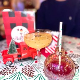 a glass of wine and a candy apple a glass of wine and a candy apple