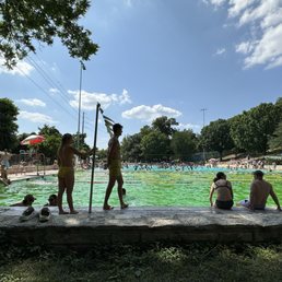 Lap pool that's green due to algae growth.