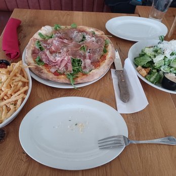 Public Pizza Italian Kitchen - Caesar salad, prosciutto and arugula pizza and parm fries. - Italian Near Me - Yonkers, New York Public Pizza Italian Kitchen - Caesar salad, prosciutto and arugula pizza and parm fries. - Italian Near Me - Yonkers, New York