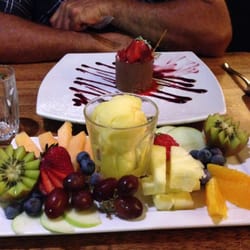 Paymaster's Restaurant - White chocolate cheesecake and seasonal fruit platter with lemon sorbet . Yum