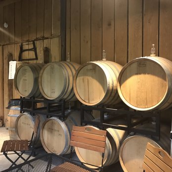 Village Winery - barrels and tables in a wine cellar - Wineries Near Me - Waterford, Virginia Village Winery - barrels and tables in a wine cellar - Wineries Near Me - Waterford, Virginia