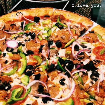 Hot Tomato Pizzeria - two pizzas on a table - Pizza Near Me - Fruita, Colorado Hot Tomato Pizzeria - two pizzas on a table - Pizza Near Me - Fruita, Colorado
