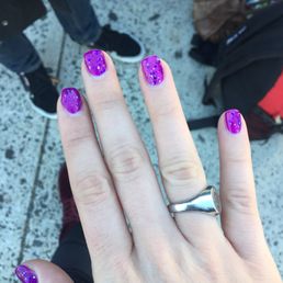 Gel nails with first coat of purple, second coat of purple and silver sparkle!