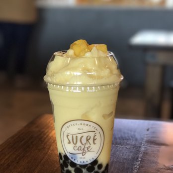 Sucre Cafe - Mango smoothie with tapioca and mango bits. - Desserts Near Me - Plano, Texas Sucre Cafe - Mango smoothie with tapioca and mango bits. - Desserts Near Me - Plano, Texas