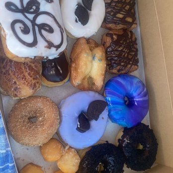 SloDoCo Donuts - Galaxy donut, lavender oreo, 2 espresso with coffee cookie crumbles on top, the square donut is stuffed with cookies dough and more! - Donuts Near Me - San Luis Obispo, California