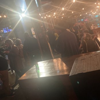 Trap Kitchen - a group of people standing around a bar - Comfort Food Near Me - New Orleans, Louisiana Trap Kitchen - a group of people standing around a bar - Comfort Food Near Me - New Orleans, Louisiana