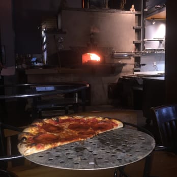 Folino's Pizza - Pepperoni pizza with wood fire in background - Pizza Near Me - Shelburne, Vermont Folino's Pizza - Pepperoni pizza with wood fire in background - Pizza Near Me - Shelburne, Vermont