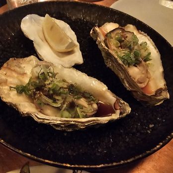 Salt + Charcoal - Lightly grilled oyster in a sake soy sauce - Japanese Near Me - Brooklyn, New York Salt + Charcoal - Lightly grilled oyster in a sake soy sauce - Japanese Near Me - Brooklyn, New York