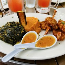 Rumba Island Bar & Grill - Early menu jumbo coconut shrimp with Mashed Sweet Potatoes & Jamaican Greens